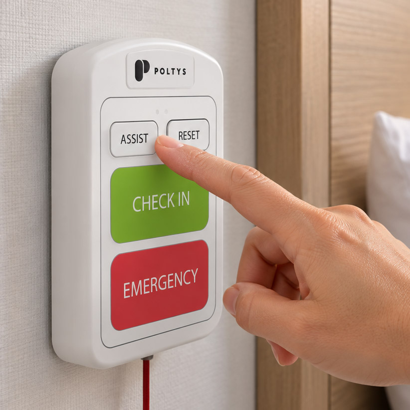 Caregiver pressing Assist on a wall-mounted multicall station